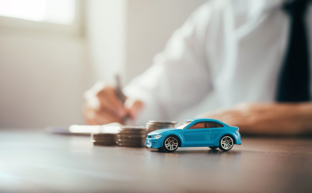 car tax concept financial statements with coins Auto Tax and Auto Insurance, Auto Finance