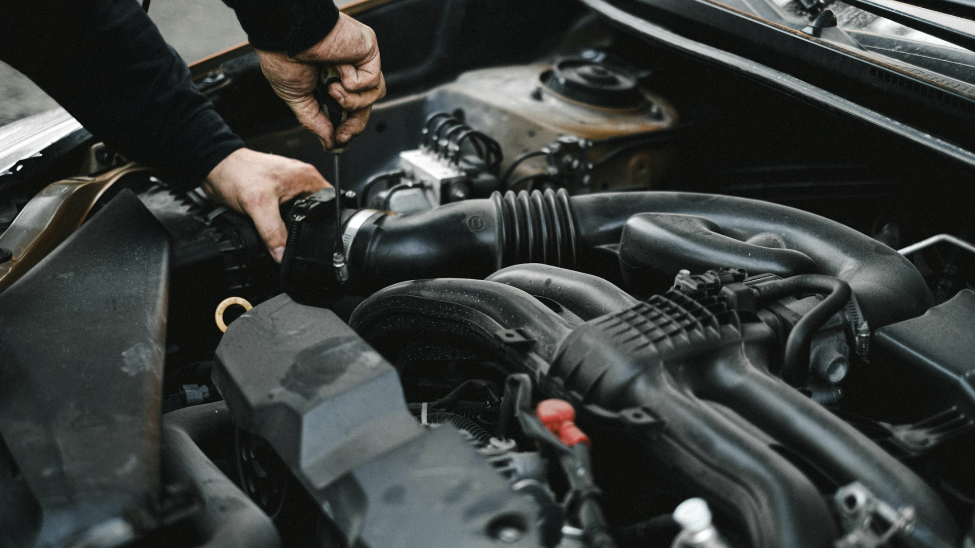 My Car Care Services technician performing air filtration services on a customer vehicle in Fredericksburg, VA