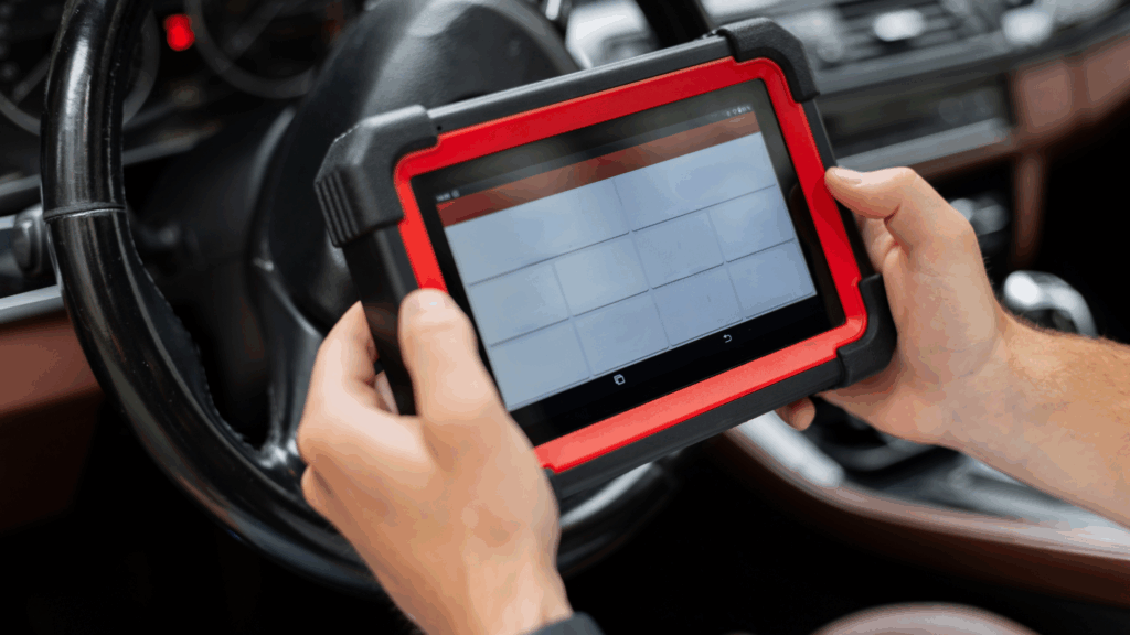 Technician performing car engine diagnostics at My Car Care