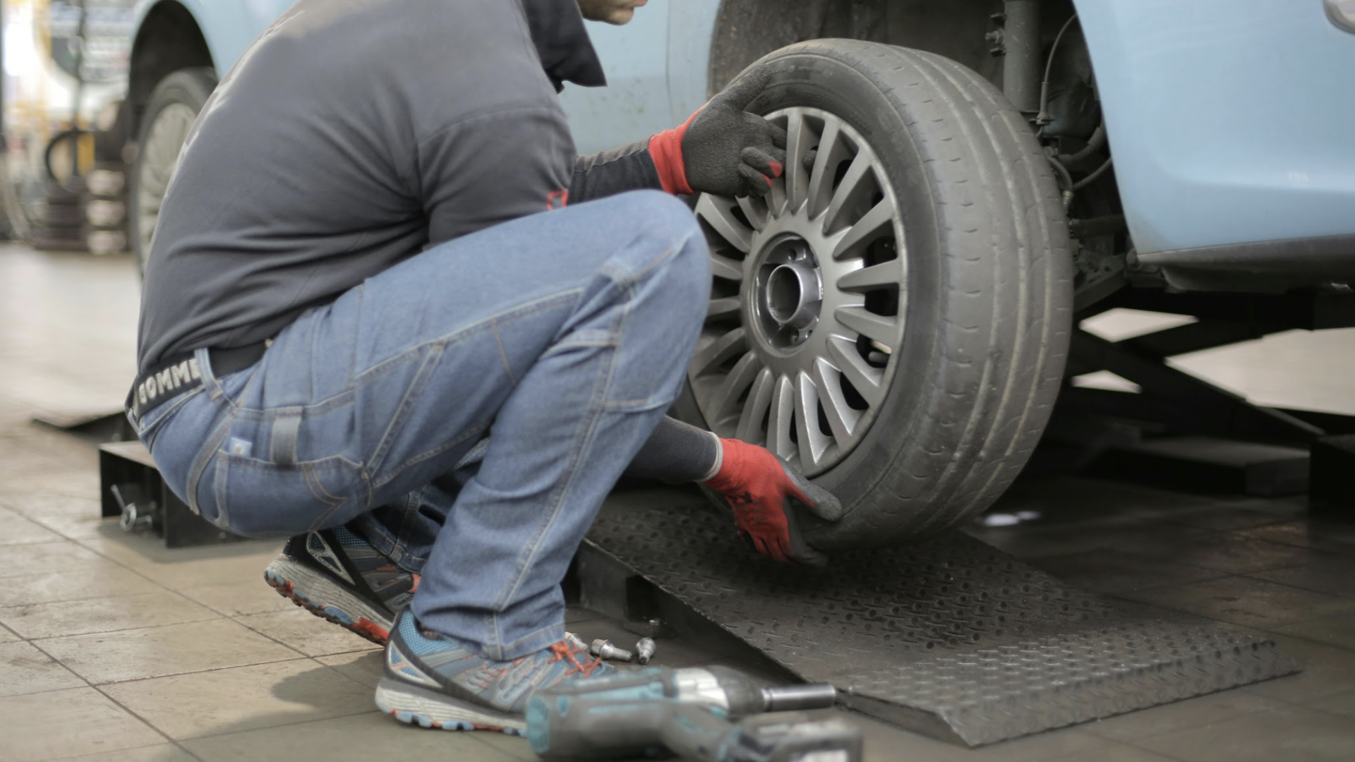 My Car Care Services technician performing tire & wheel services on a customer vehicle in Fredericksburg, VA
