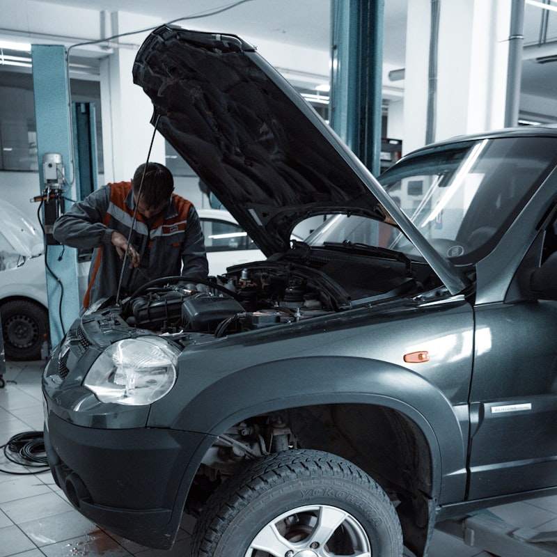 Technician performing car engine diagnostics at My Car Care
