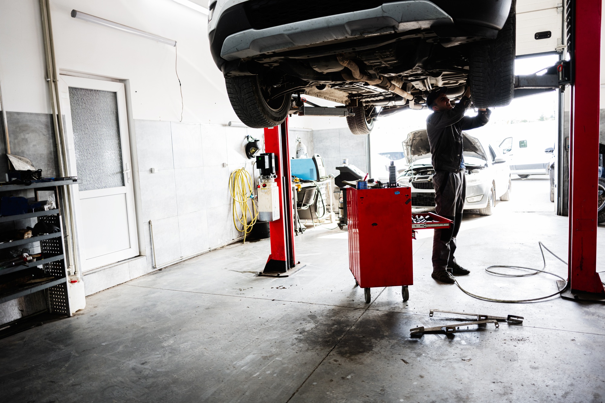 Technician performing car engine diagnostics at My Car Care